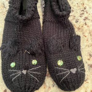 NEW. Black cat slipper socks. Knitted too with grey “suede” bottom size 7-8.